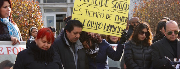 Lilia Esperanza Parra Aucapina's brother, Carlos Parra, and her niece,Maria Duchi, share a moment of silence in memory of their sister and aunt in front of Southampton Town Hall on Tuesday.