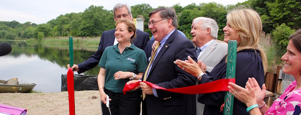 Elected leaders and DEC staff cut the ribbon on the new fish ladder Thursday morning.