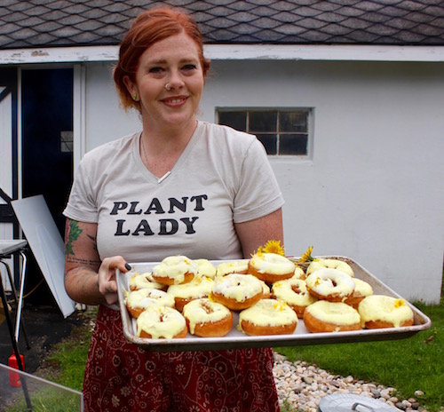 Jess Morris of the North Fork Roasting Company with her dandelion donuts, freshly baked and still warm.