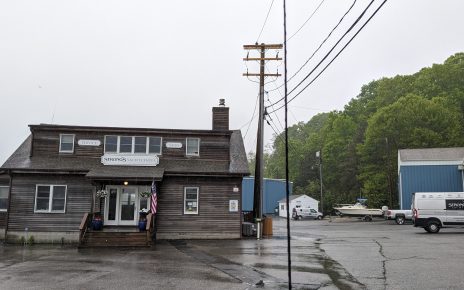 Strong's Yacht Center, on Mattituck Inlet. The proposed yacht storage buildings would be on the wooded hill to the right of this photograph.