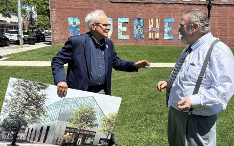 Riverhead Councilman Bob Kern (left), with an architectural rendering of the Science Center, with Long Island Science Center President Larry Oxman (right) at the press conference in Riverhead's Town Square.