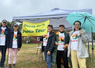 Foodie Tour organizers Robert Deak, Amy Gadol, Sue Hearn, Ellen Zimmerman and Geri Armine-Klein awaited tourgoers Sunday morning.